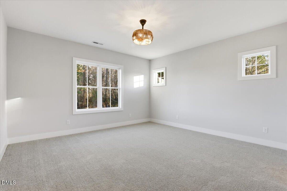 47 Gold Court Kenly, NC 27542 - Photo 17 of 32 a view of an empty room with a window