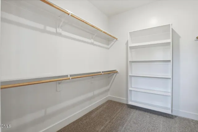 a view of an empty walk in closet