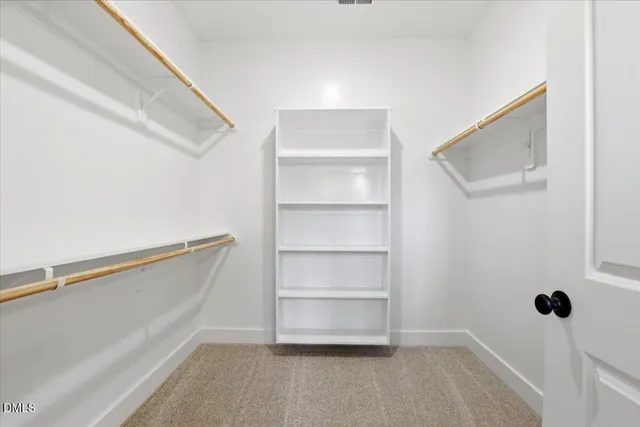 a view of an empty walk in closet