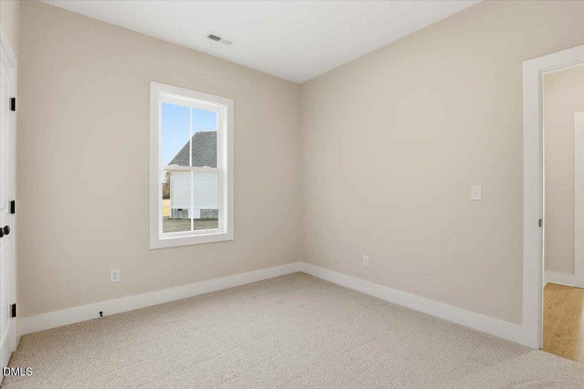 47 Gold Court Kenly, NC 27542 - Photo 27 of 32 an empty room with a window