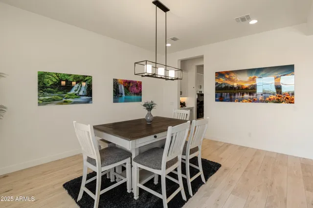 a room with gym equipment and a view of living room