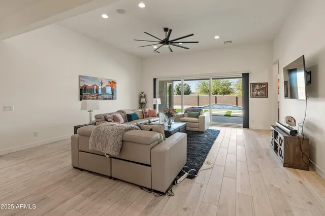 a bathroom with a sink a toilet a glass door a shower and a mirror