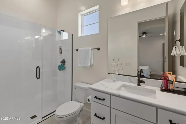 a kitchen with a table chairs refrigerator and microwave