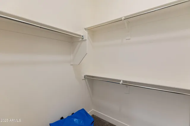 a large kitchen with a table and chairs