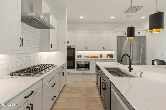 a bathroom with a shower and a sink
