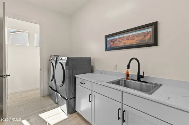 a spacious bathroom with a double vanity sink mirror and