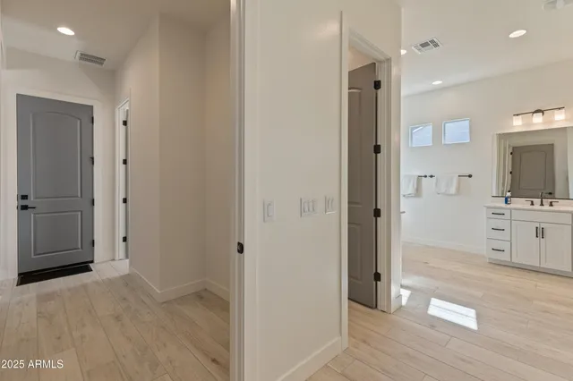 a spacious bedroom with a bed and a window