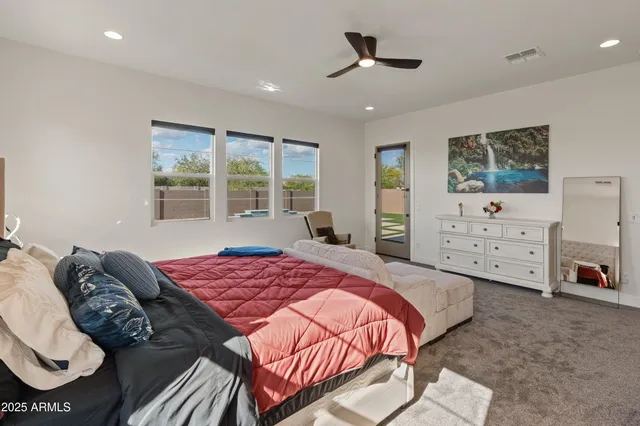 a view of a livingroom with furniture and a flat screen tv