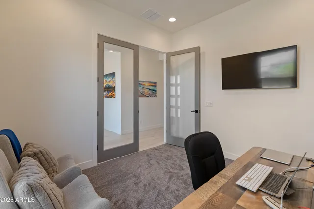 a bathroom with a sink a vanity and a mirror