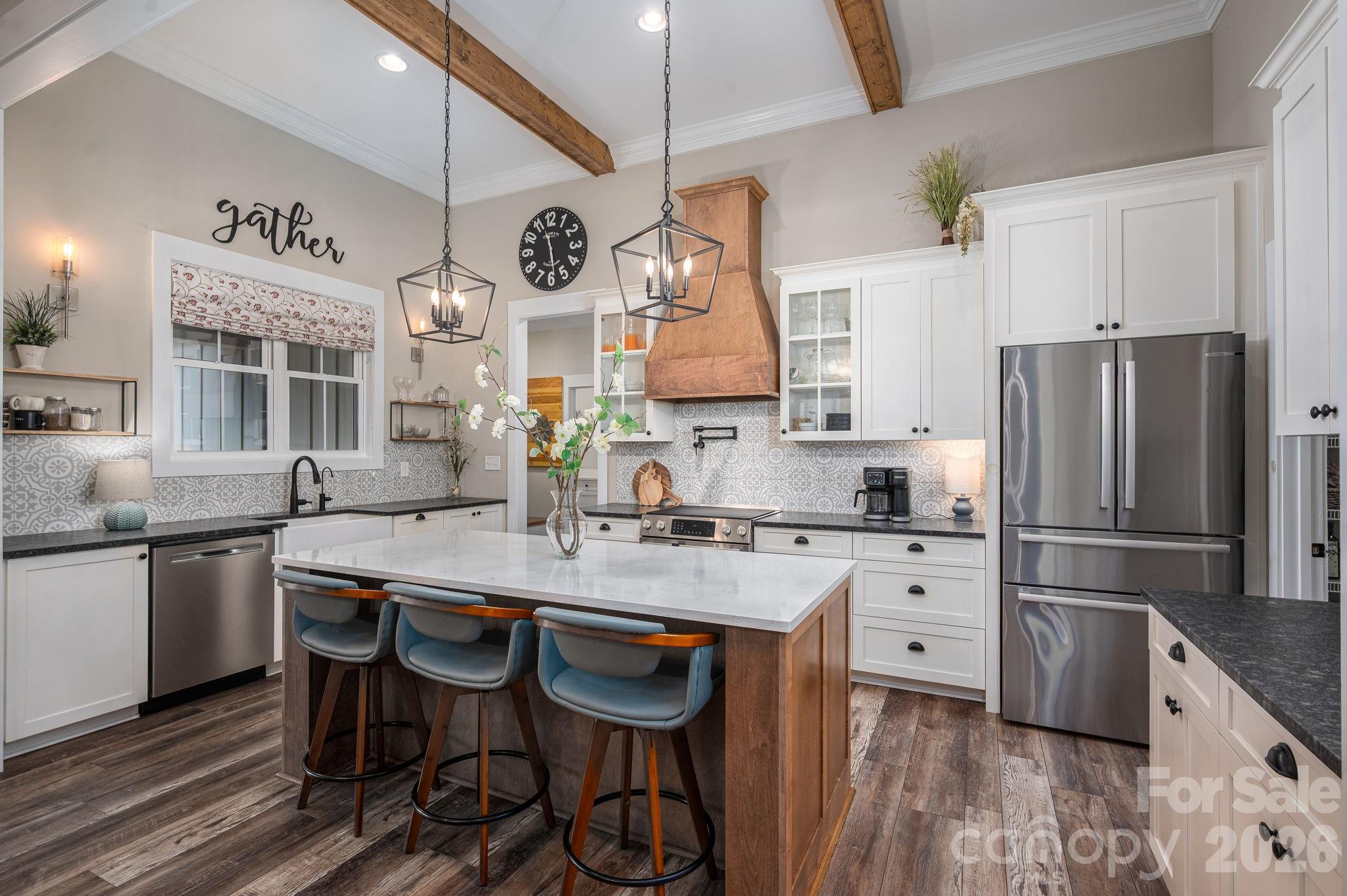 2656 Lee Lawing Road Lincolnton, NC 28092 - Photo 12 of 48 a kitchen with stainless steel appliances granite countertop a sink a stove and a refrigerator
