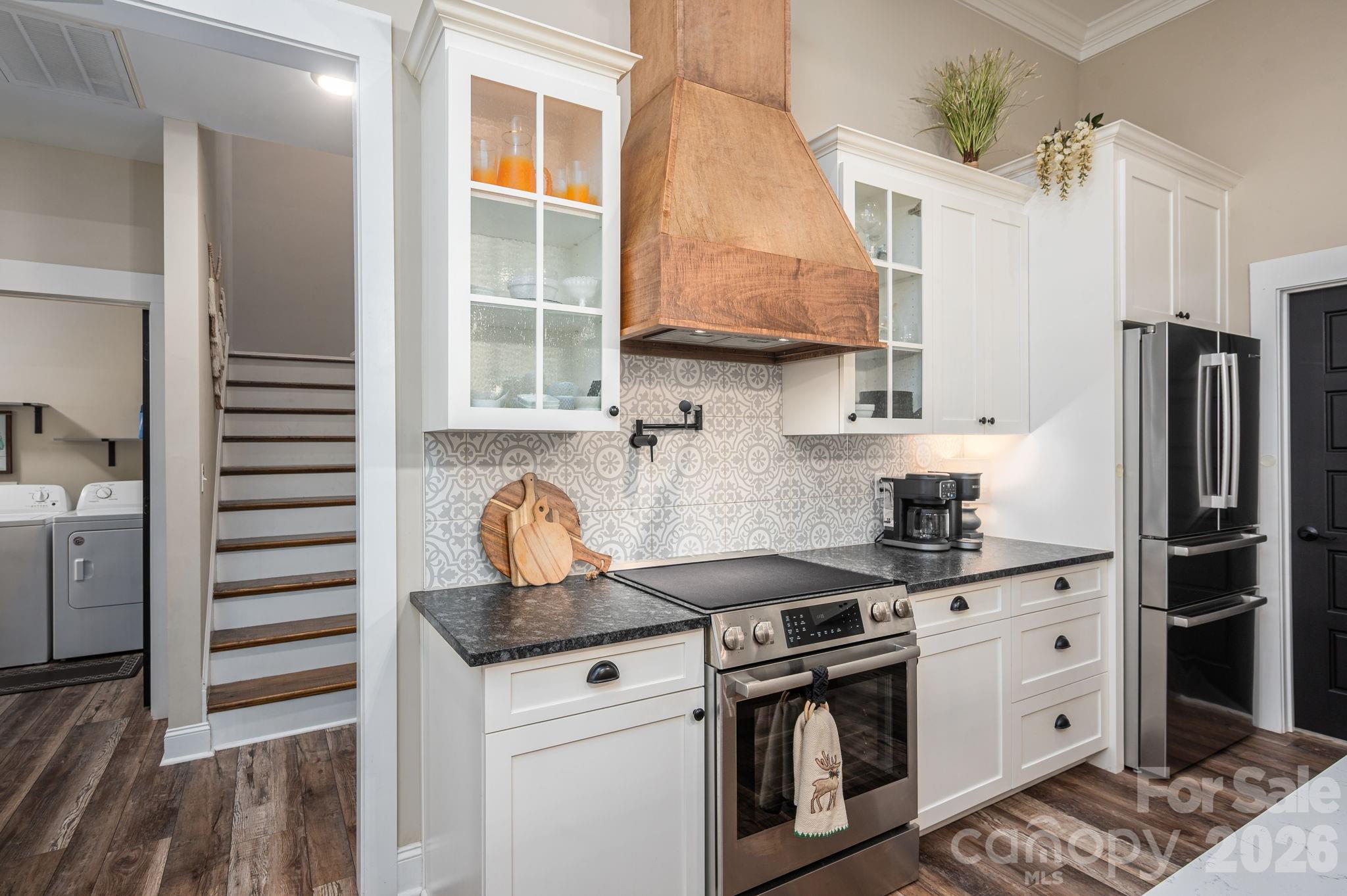 2656 Lee Lawing Road Lincolnton, NC 28092 - Photo 13 of 48 a kitchen with stainless steel appliances granite countertop a stove a sink and a refrigerator