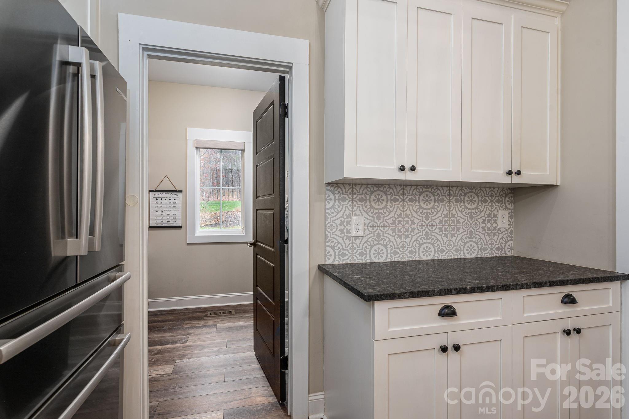 2656 Lee Lawing Road Lincolnton, NC 28092 - Photo 15 of 48 a kitchen with granite countertop white cabinets and a stove