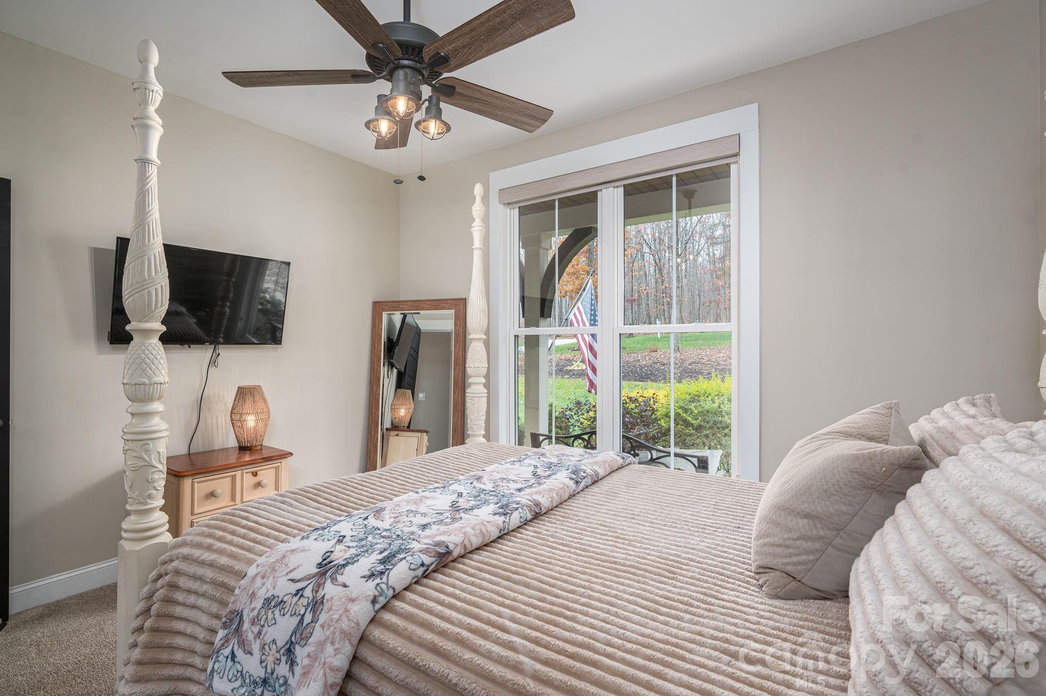 2656 Lee Lawing Road Lincolnton, NC 28092 - Photo 20 of 48 a bedroom with a bed and a flat tv screen on the dresser