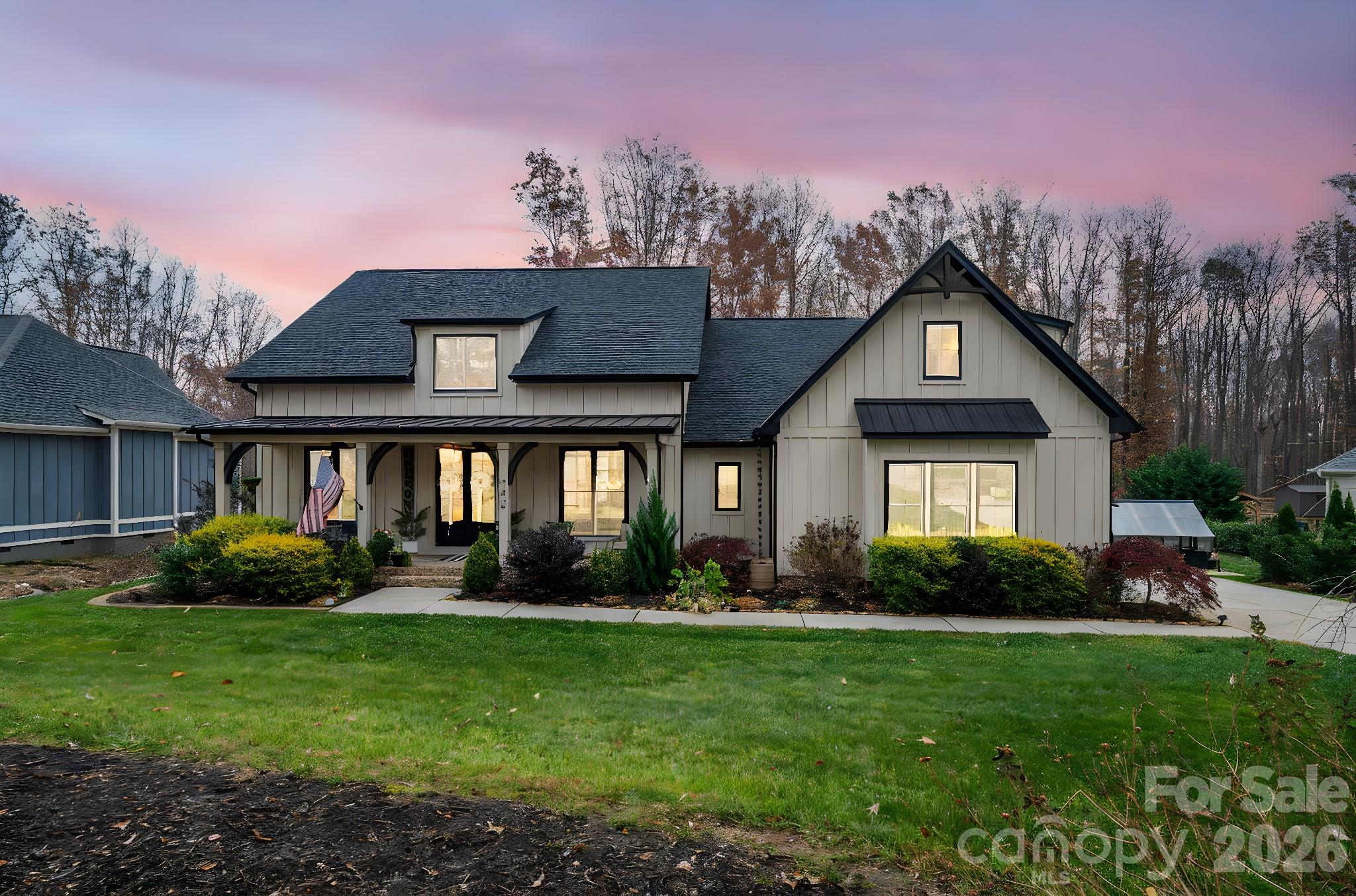 2656 Lee Lawing Road Lincolnton, NC 28092 - Photo 2 of 48 a front view of a house with a garden