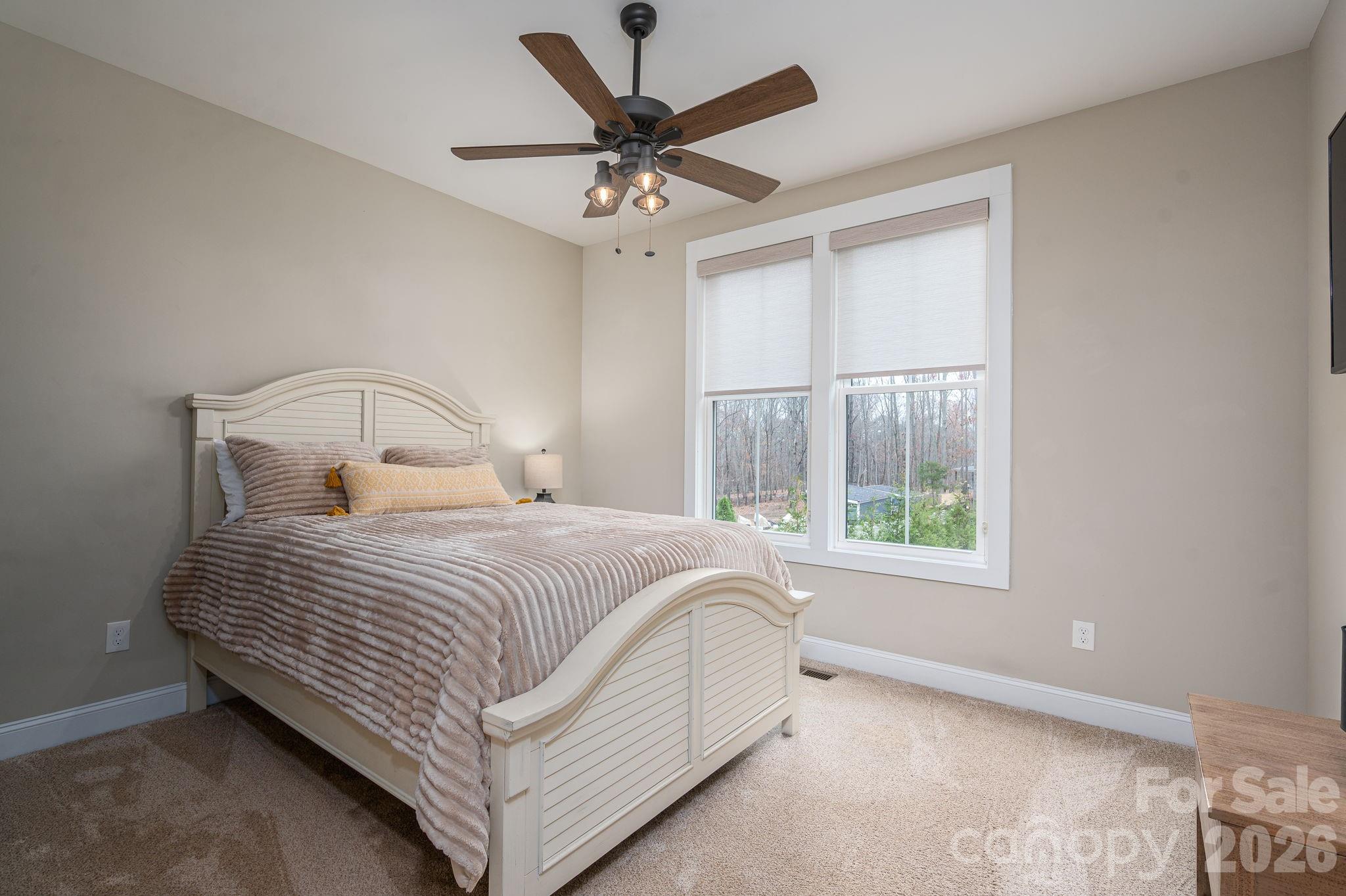 2656 Lee Lawing Road Lincolnton, NC 28092 - Photo 21 of 48 a bedroom with a bed and window