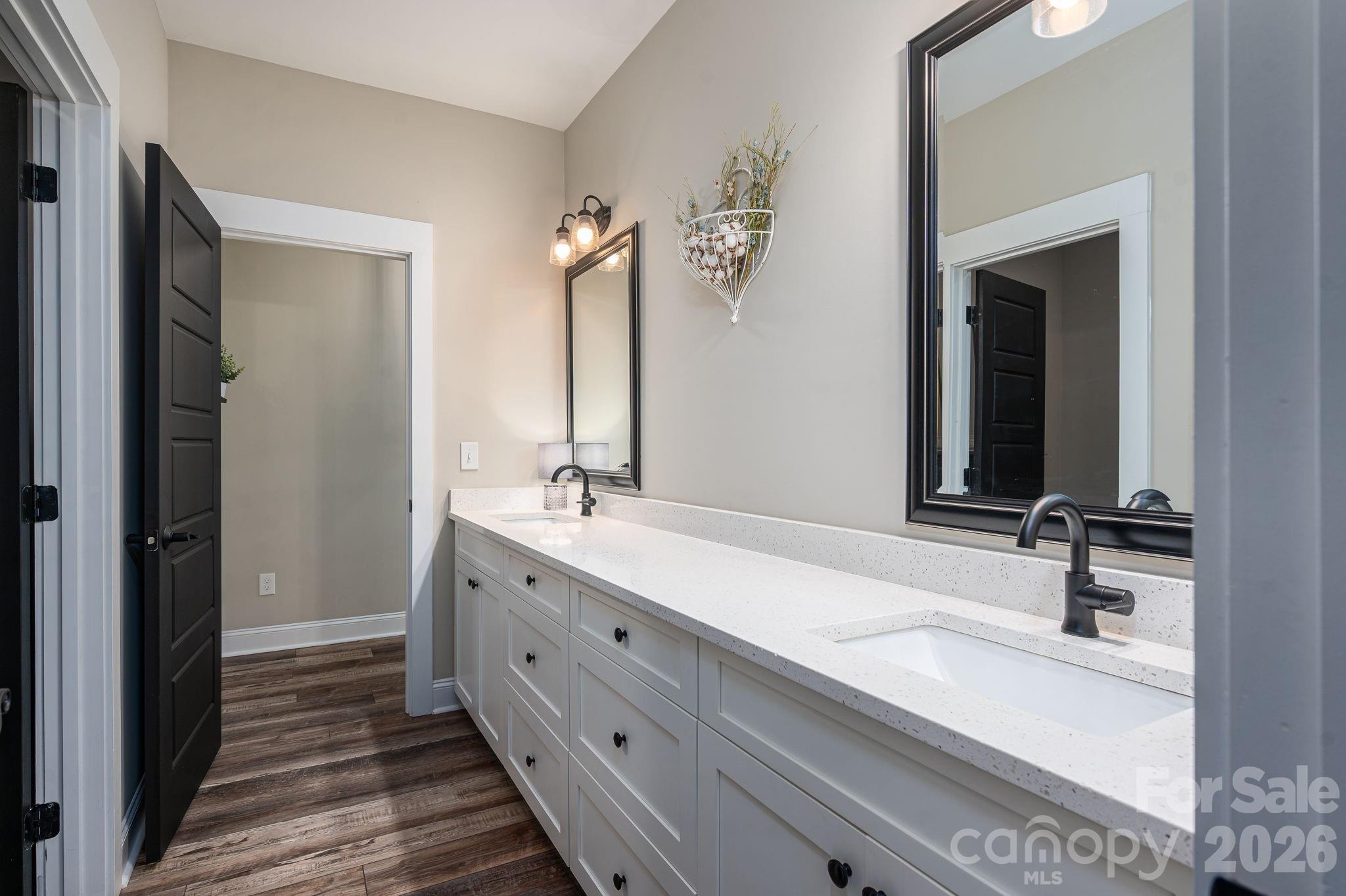 2656 Lee Lawing Road Lincolnton, NC 28092 - Photo 22 of 48 a bathroom with a double vanity sink and mirror