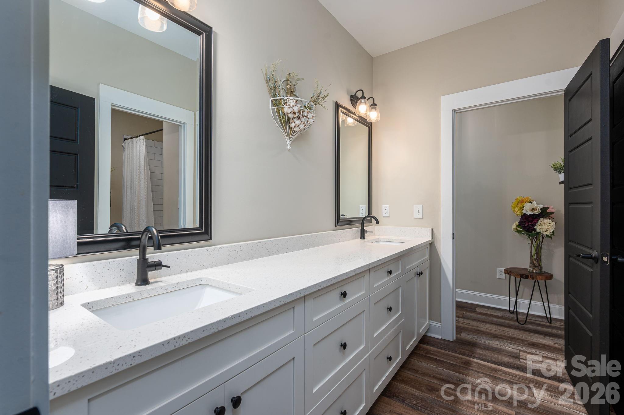 2656 Lee Lawing Road Lincolnton, NC 28092 - Photo 23 of 48 a bathroom with a double vanity sink and a mirror