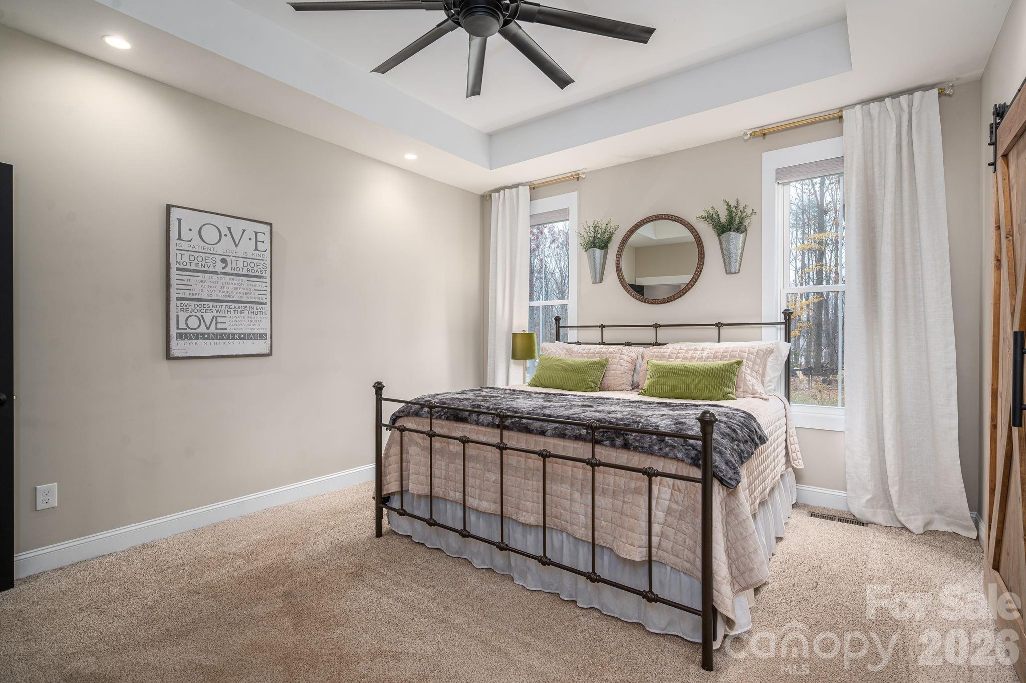 2656 Lee Lawing Road Lincolnton, NC 28092 - Photo 26 of 48 a bedroom with a bed mirror and a window