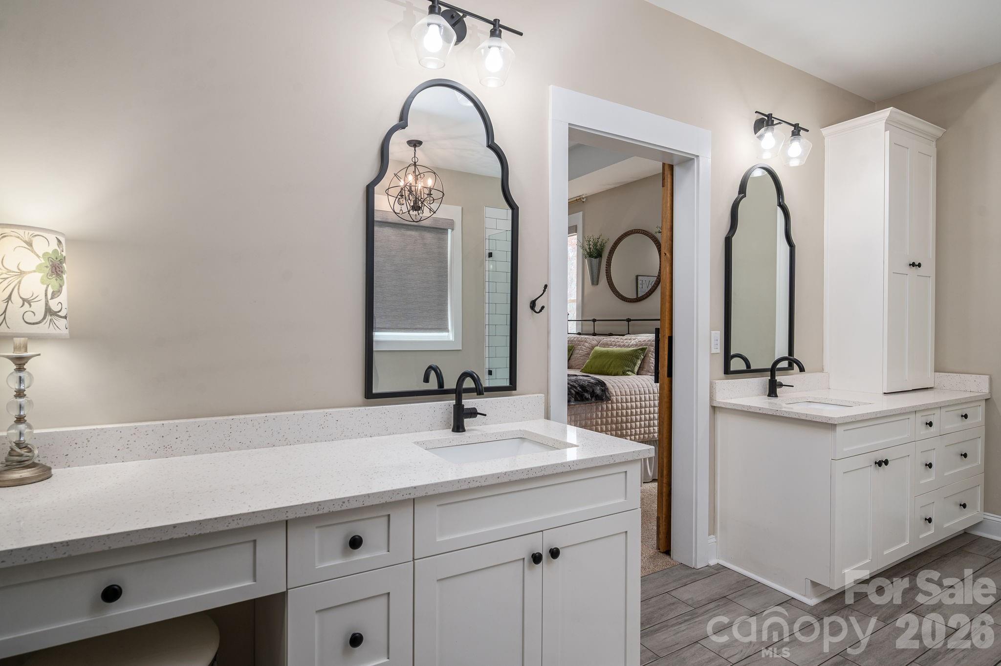 2656 Lee Lawing Road Lincolnton, NC 28092 - Photo 27 of 48 a bathroom with a sink vanity and a mirror