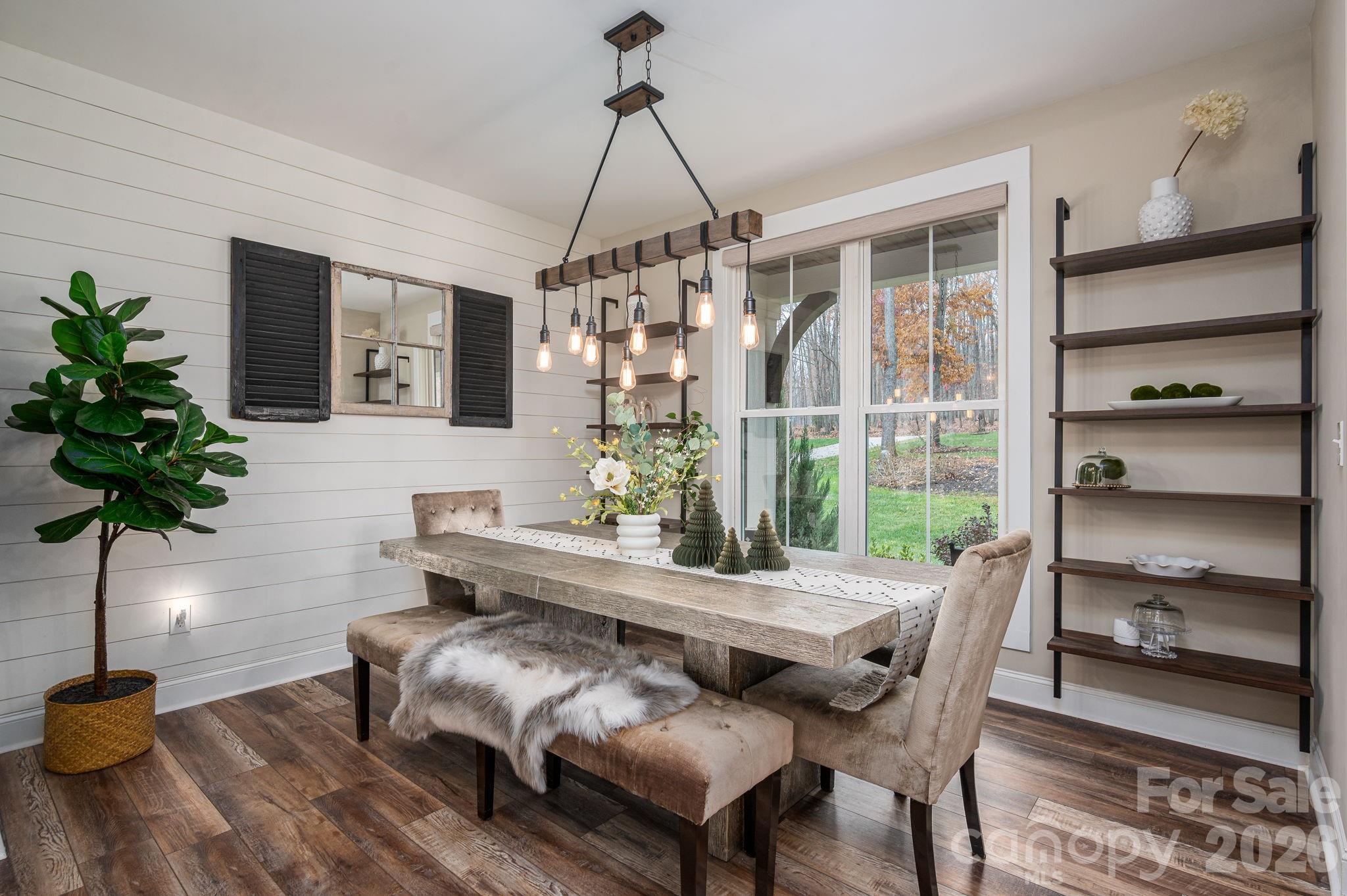 2656 Lee Lawing Road Lincolnton, NC 28092 - Photo 7 of 48 a dining room with furniture potted plants and wooden floor