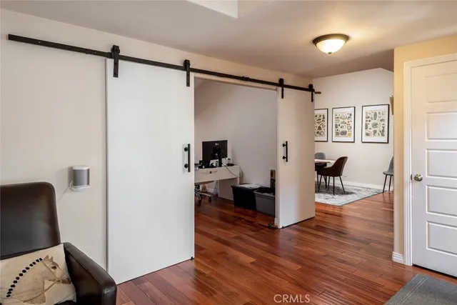 a view of a living room and a wooden floor