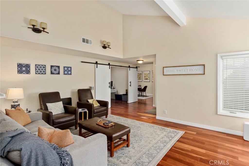 25 Birdsong Irvine, CA 92604 - Photo 13 of 29 a living room with furniture and wooden floor