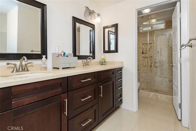 a bathroom with a double vanity sink mirror and double