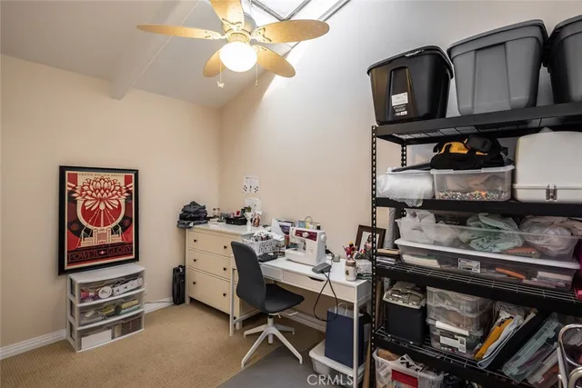 a room with furniture a flat screen tv and a window