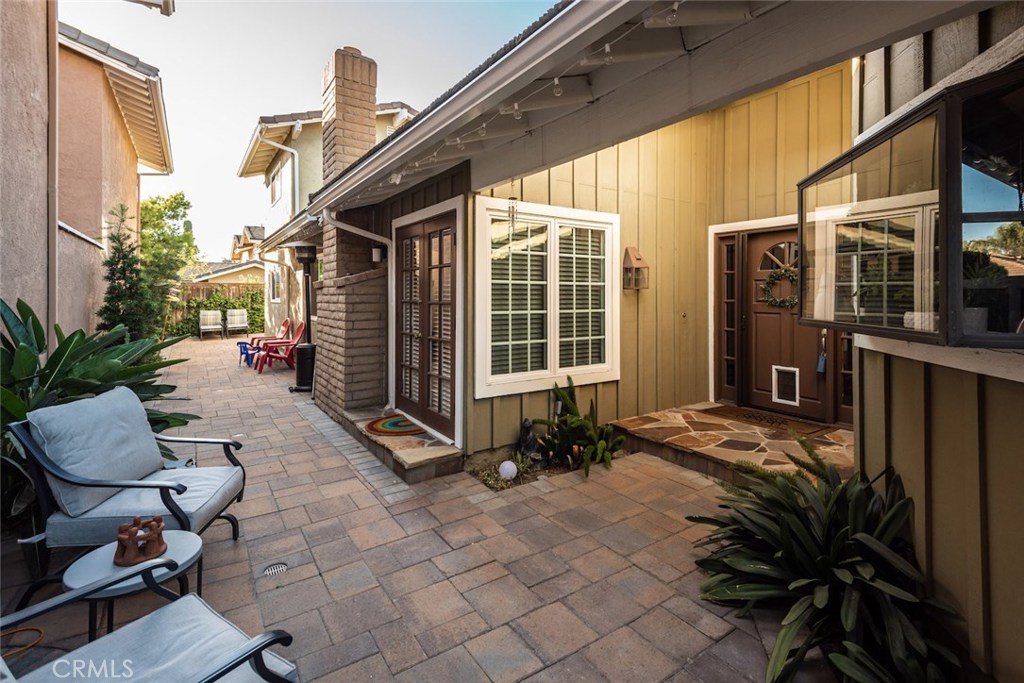 25 Birdsong Irvine, CA 92604 - Photo 22 of 29 a view of backyard with a table and chairs and potted plants