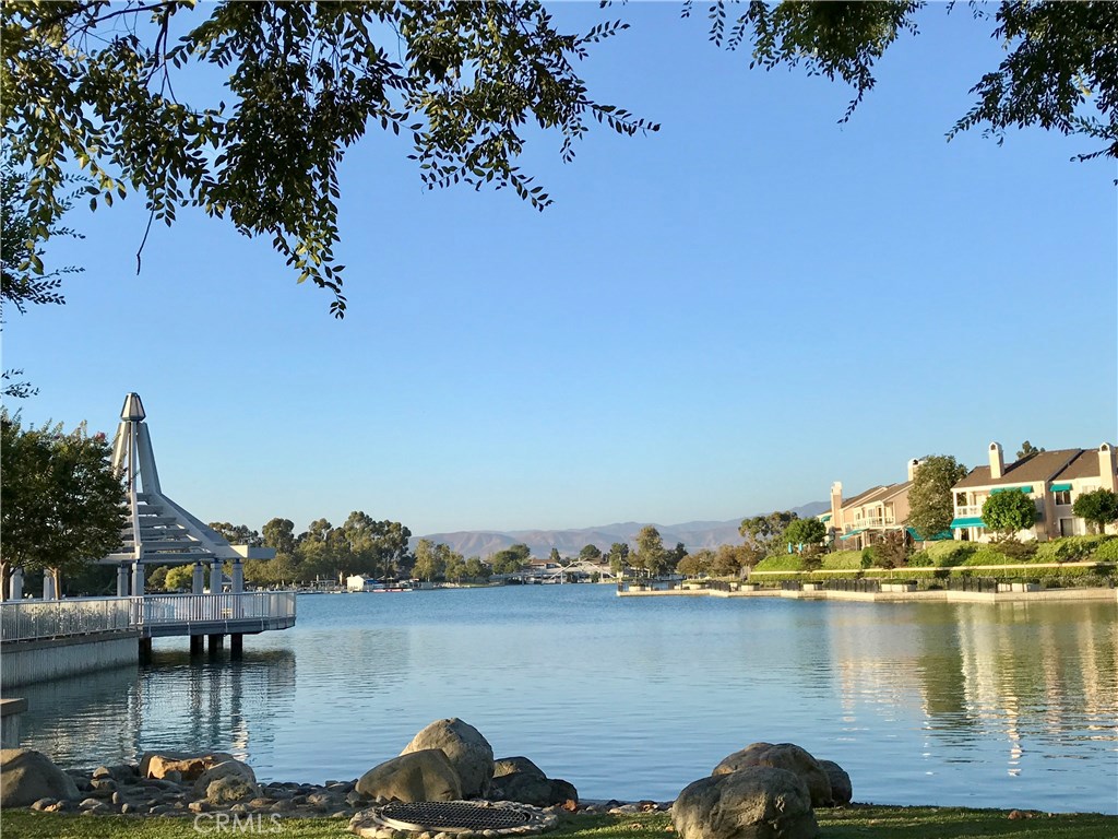 25 Birdsong Irvine, CA 92604 - Photo 25 of 29 a view of a lake with boats and trees in the background
