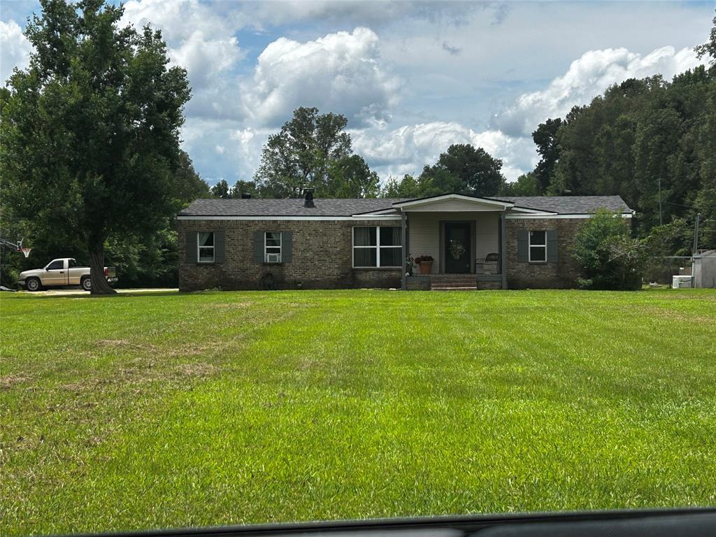 175 Bozman Road Stonewall, LA 71078 - Photo 1 of 8 a view of house with a big yard