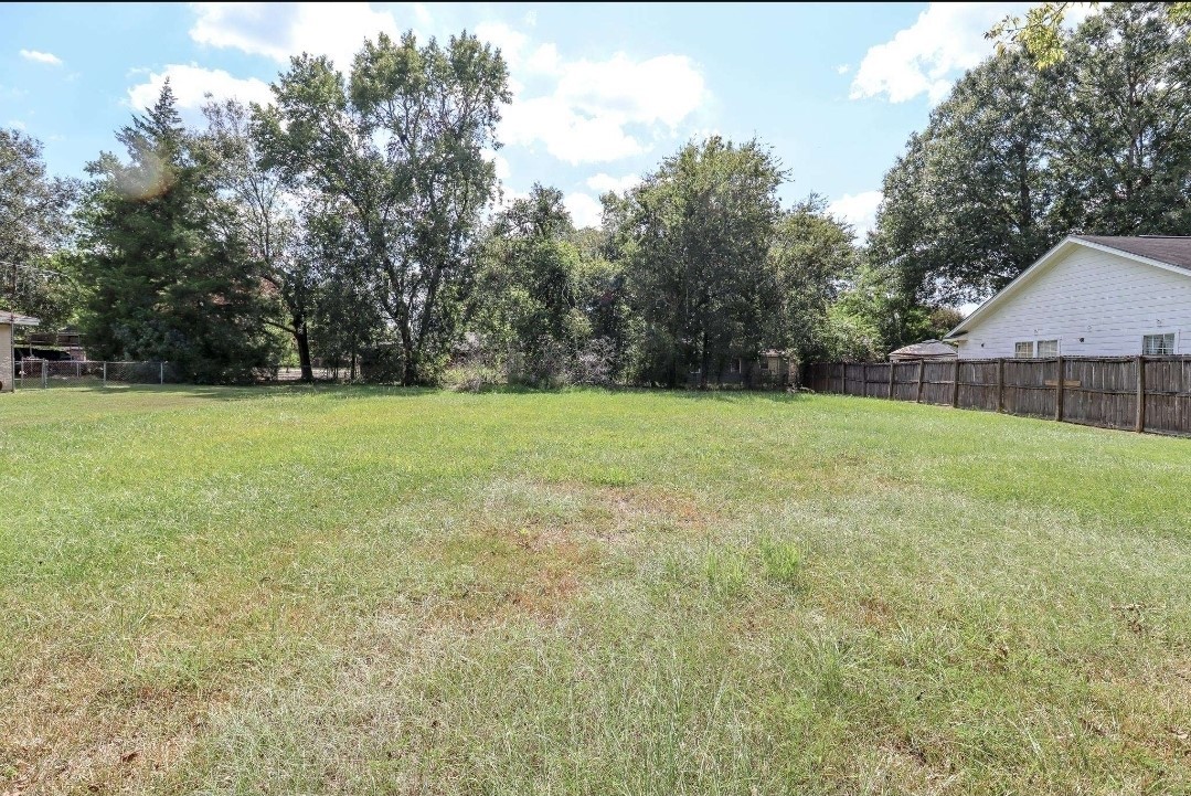 0 Josey Street Beaumont, TX 77707 - Photo 2 of 9 a view of a green field with trees in the background
