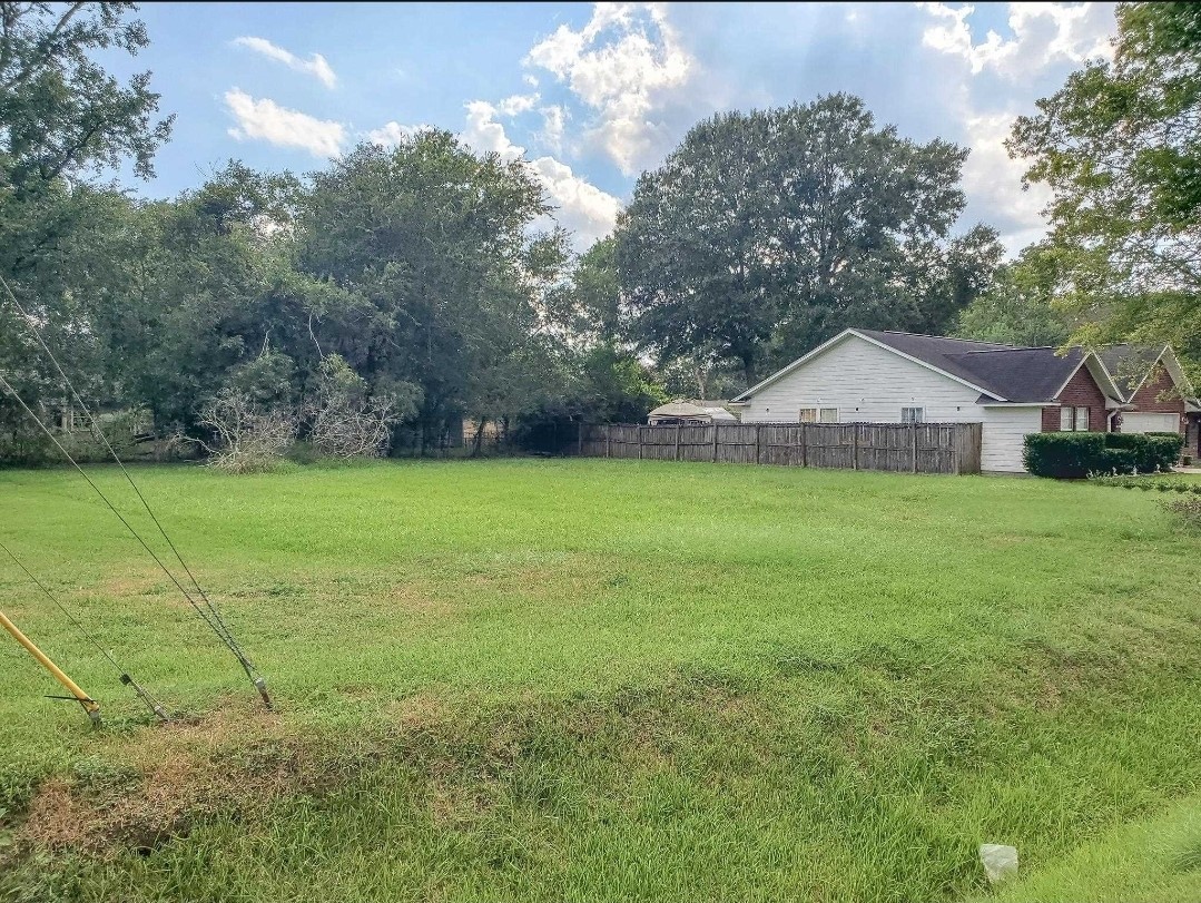 0 Josey Street Beaumont, TX 77707 - Photo 4 of 9 a front view of a house with yard and green space