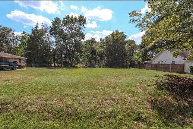 a view of outdoor space with deck and yard