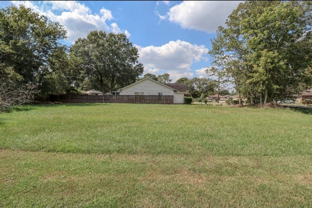 0 Josey Street Beaumont, TX 77707 - Photo 6 of 9 a view of a big yard with plants and large trees