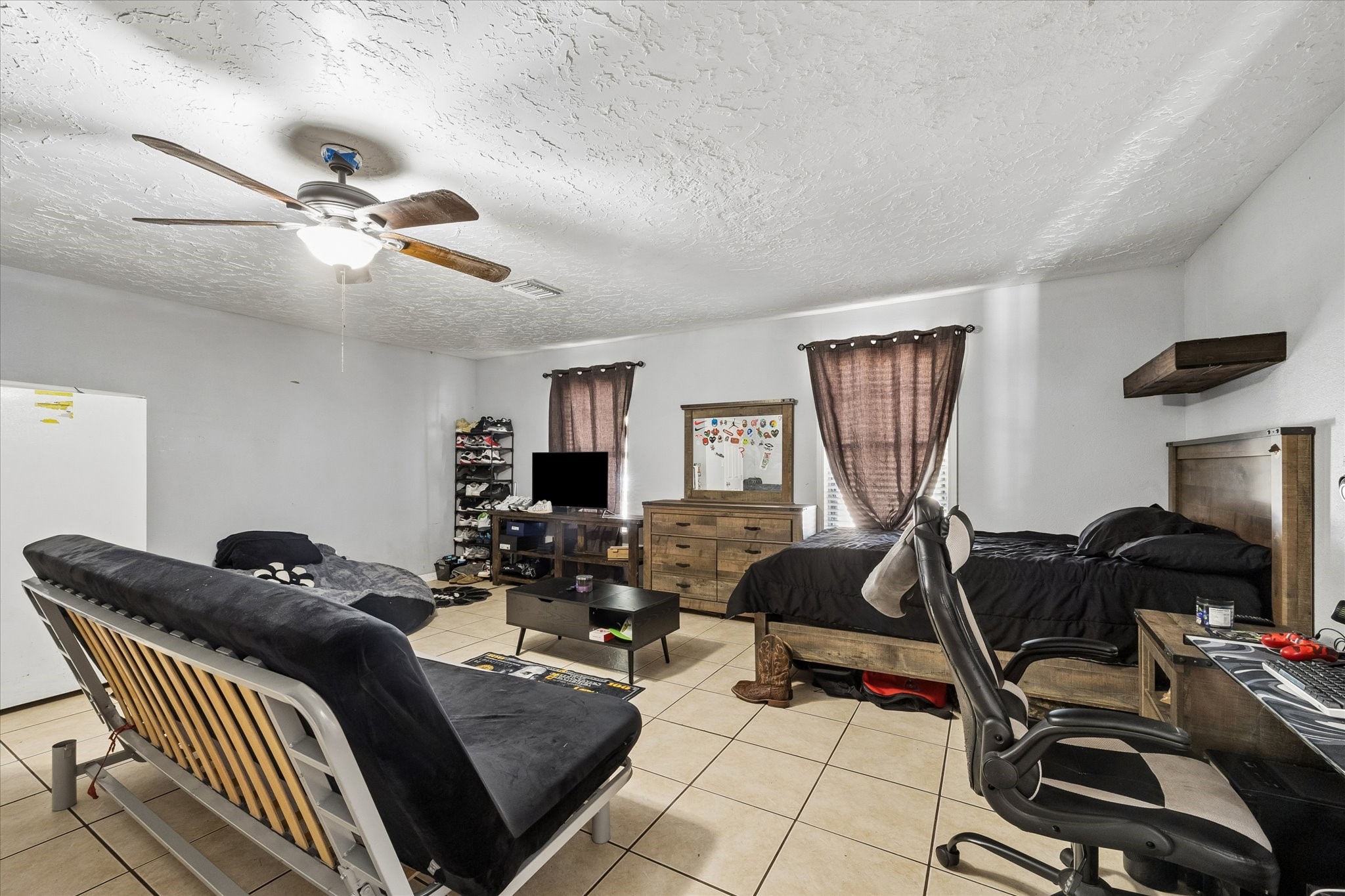 23115 Stepinwolf Lane Spring, TX 77373 - Photo 13 of 18 Very spacious bedroom, It features tiled floors, a ceiling fan, and ample natural light.