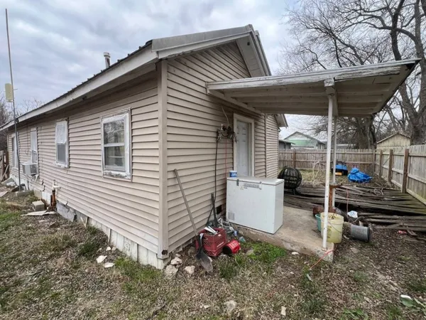a view of a backyard with sitting area