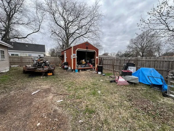 a view of a house with a back yard