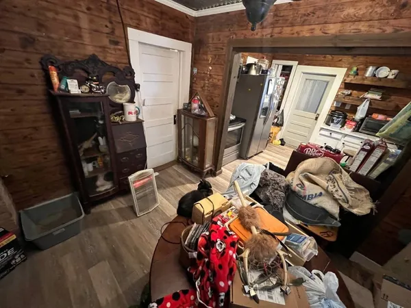 a view of walk in closet with clothes