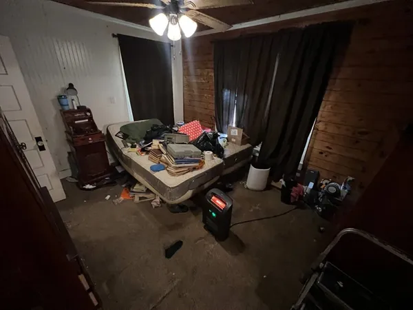 a living room with furniture and a mirror