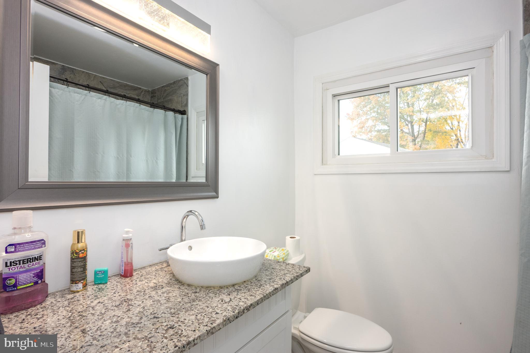 458 Roberts Way Aberdeen, MD 21001 - Photo 12 of 22 a bathroom with a granite countertop sink toilet and mirror