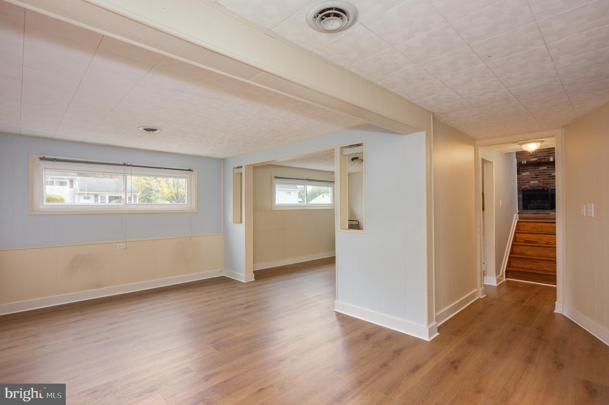 458 Roberts Way Aberdeen, MD 21001 - Photo 15 of 22 an empty room with wooden floor and windows