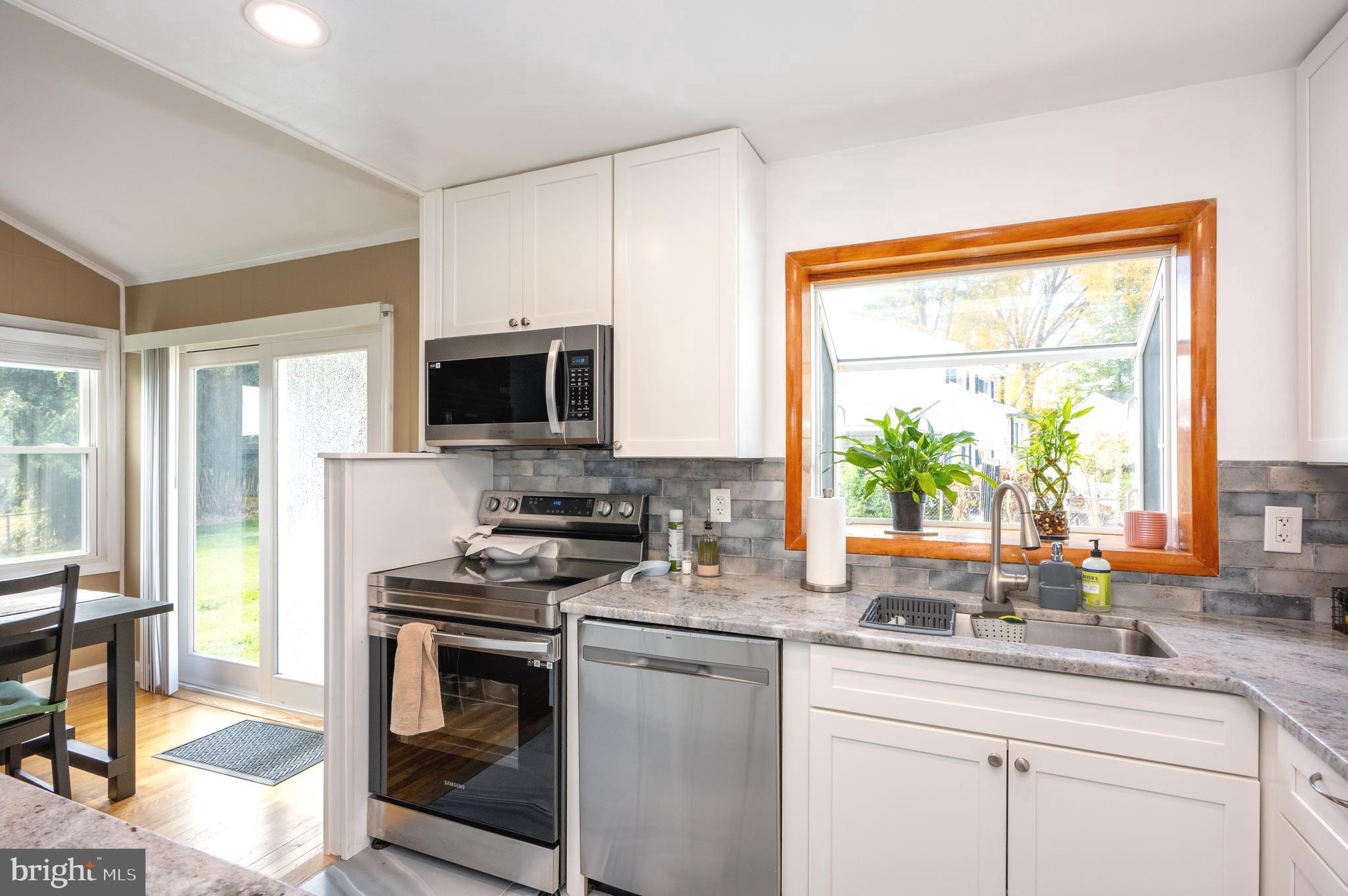 458 Roberts Way Aberdeen, MD 21001 - Photo 8 of 22 a kitchen with a sink stove and microwave