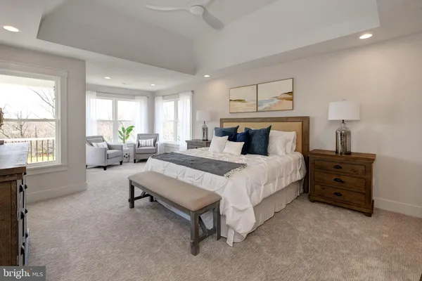a bedroom with bed and window