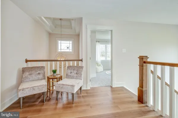 a view of a livingroom with furniture and wooden floor