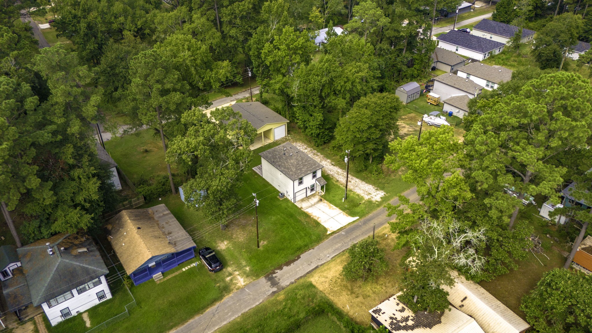 155 Cherry Tree Livingston, TX 77351 - Photo 18 of 24 an aerial view of a house with a yard and lake view