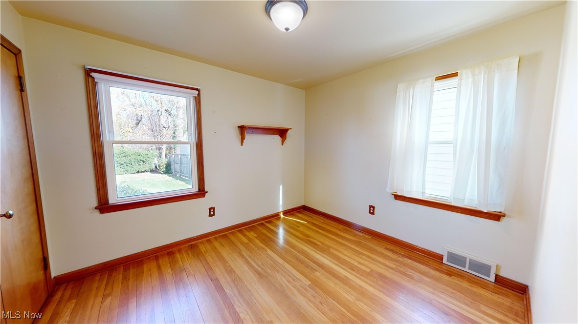 22581 Chardon Road Euclid, OH 44117 - Photo 14 of 34 Spare room with light wood-type flooring