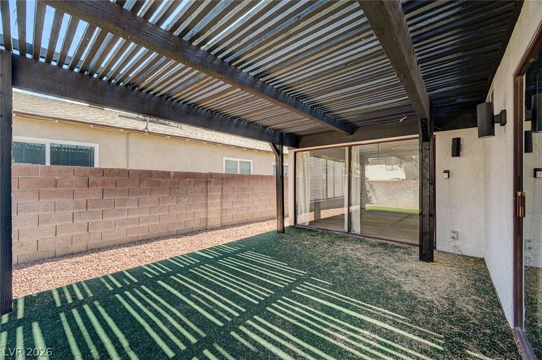 4840 Summerhill Road Las Vegas, NV 89121 - Photo 38 of 56 A spacious covered patio provides a delightful outdoor living area with a view of the private yard.
