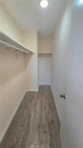 a bathroom with a toilet a sink and a mirror