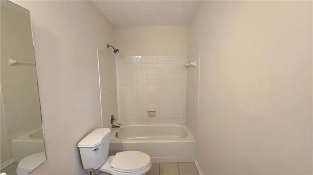 a bathroom with a toilet and a sink